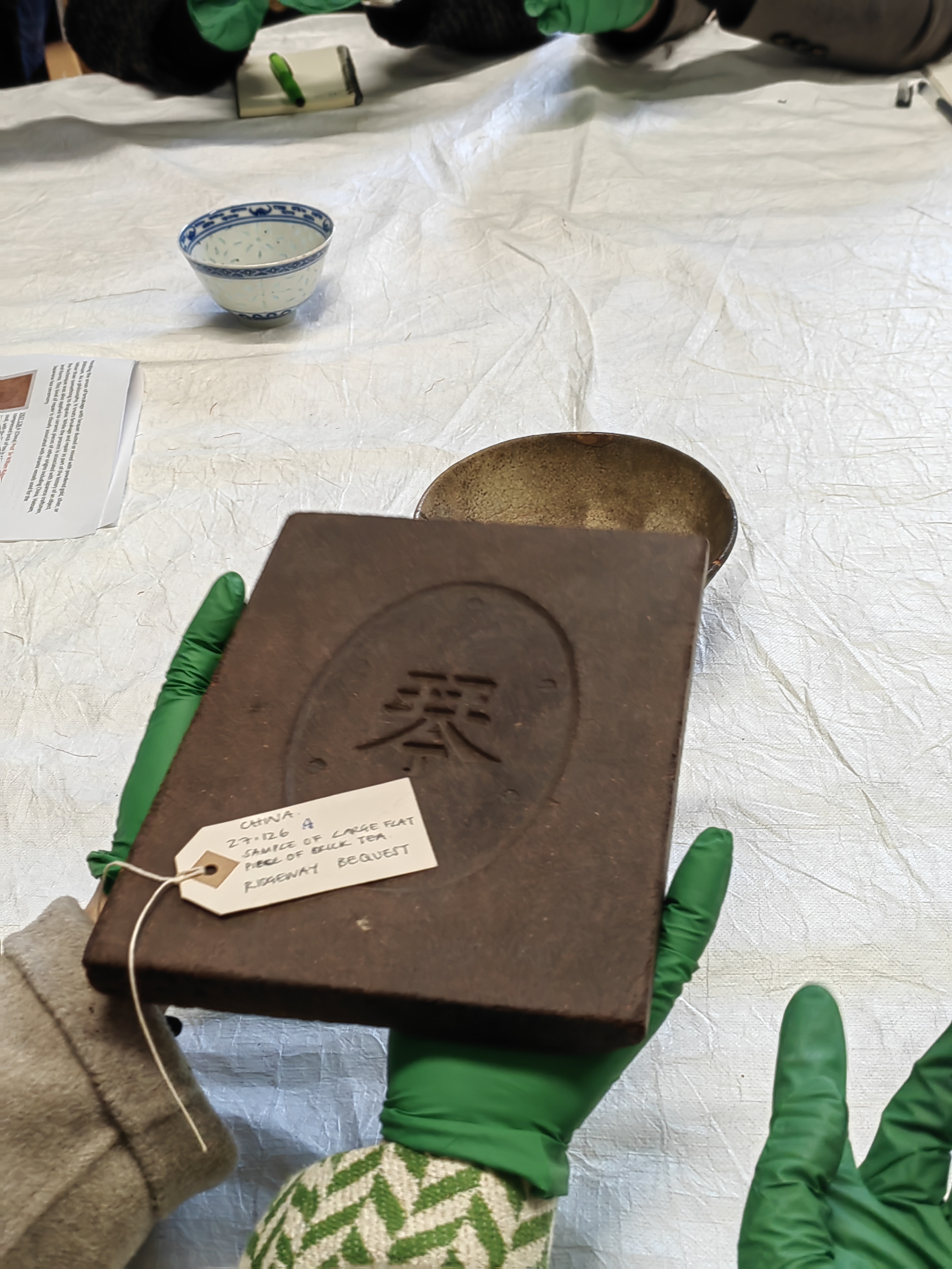 A sample of large flat piece of brick tea